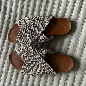 Sandals.   Can be dressed up or down.